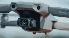 A close-up of a drone with a camera mounted on the front